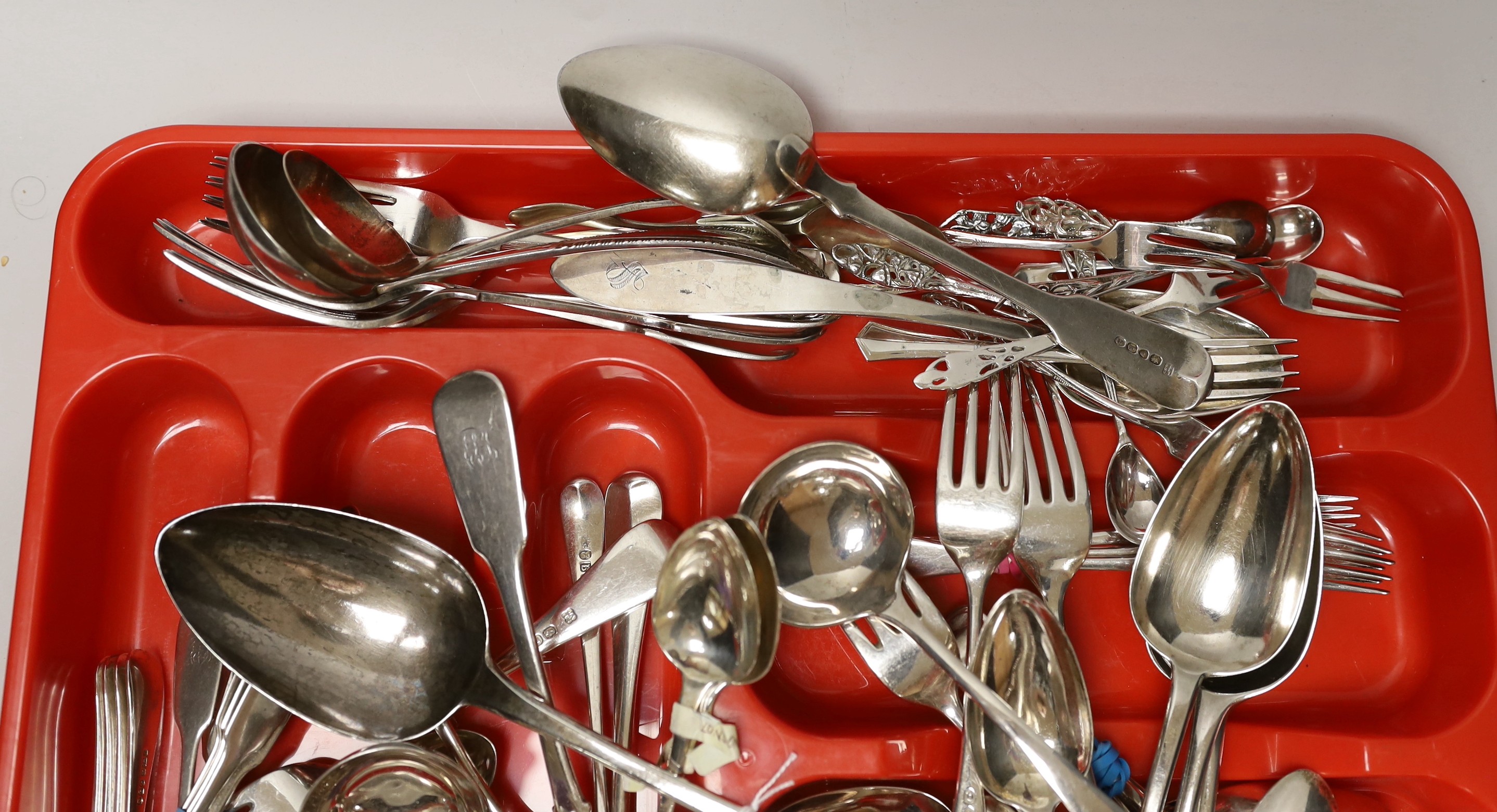 A large quantity of mixed silver cutlery, various dates, makers and patterns, including a George III silver basting spoon, a silver cigarette case and a small group of plated flatware.